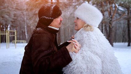 Warm Winter Companionship, Retired Individuals Forge Bonds Amidst Winter Pine Scenery, Older Professionals Find Comfort And Camaraderie During Snowy Days Surrounded By Lush Pine Forests