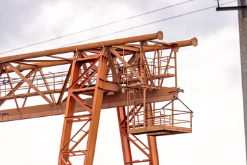 Hoist of Industrial crane in factory workshop interior. Gantry crane for lifting the heavy load object in the casting yard.