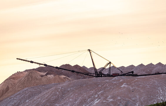 Bagger operation in surface mine. A backloader and a bucket wheel excavator in a lignite mine. Industrial stone production, crushed stone production, stone mining, crushed stone mining plant
