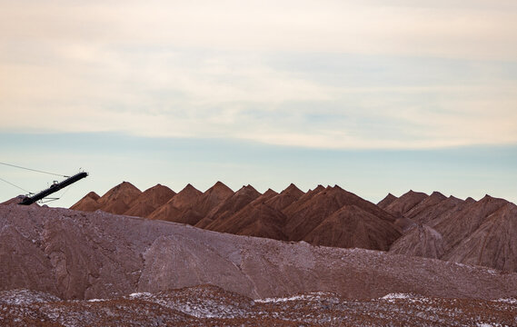 Bagger operation in surface mine. A backloader and a bucket wheel excavator in a lignite mine. Industrial stone production, crushed stone production, stone mining, crushed stone mining plant