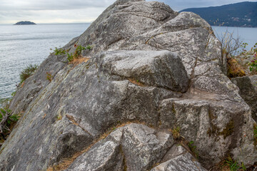 Rugged Rock Cliffs Overlooking Calm Sea Along West Coast Shore at Whitecliff, West Vancouver
