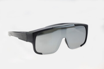 a pair of modern black smart glasses with a sleek, futuristic design, photographed in a clean studio environment, glasses are captured at three quarter angle technology, isolated on white background 