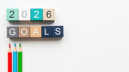 Colorful blocks with 2026 goals and colored pencils on white background