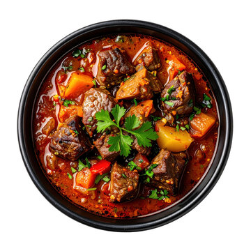 Hearty kazan kebab, a flavorful kazakh lamb and vegetable stew, served on a dark plate and isolated on a white background