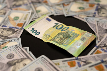 Fototapeta premium Dollars vs Euro currency. Financial success in USD and EU currency. Hundred dollar and euro bills background. Income and financial strategy. American money or European money. Currency and cash.