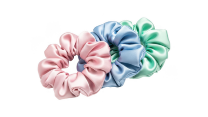 Three colorful silk scrunchies in pink, blue, and green hues isolated on transparent background