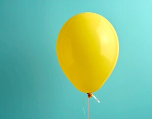 Single Yellow Balloon Floating on Minimalist Teal Blue Background with Copy Space