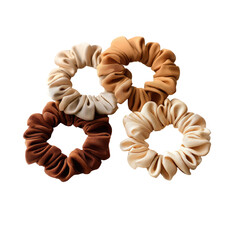 Four satin scrunchies, earthy tones, arranged in cluster