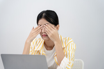 Eye problems, Asian women use hand cover eyes due to eye irritation, eye rubbing, dry, eye pain after look mobile phone long time, migraine, headache, blurred vision, photophobia, small words