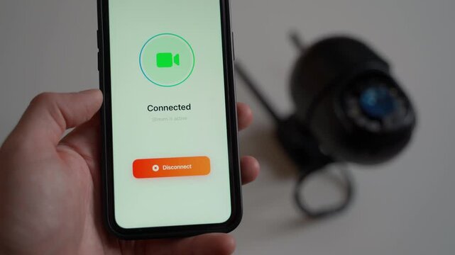 Connecting to a remote surveillance camera via a mobile app, close-up