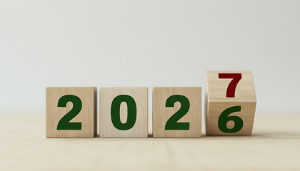 Wooden number blocks displaying years 2026 and 2027 new year transition planning concept