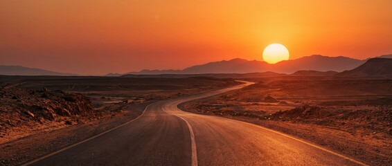 Desert Road at Golden Sunset in Vast Sandy Landscape
