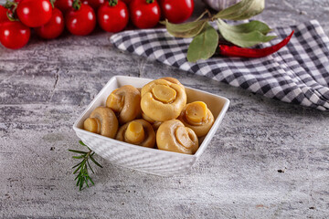 Fototapeta premium Marinated pickled champignon in the bowl