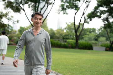 Asia elderly man exercise walk outdoor