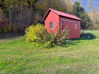 Wooden Farm Building In A Meadow