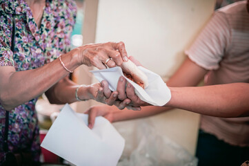 Volunteers are giving food to the homeless poor, Free distribution of food to the poor in today's society