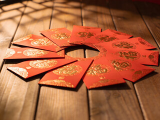 chinese new year red packets laid out in ring pattern with gold designs