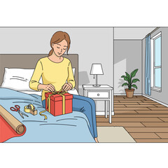 Woman joyfully wrapping gift boxes on the bed in a cozy bedroom