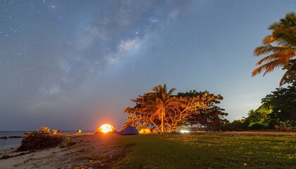 Nighttime camping adventure under a starry sky on a tropical beach