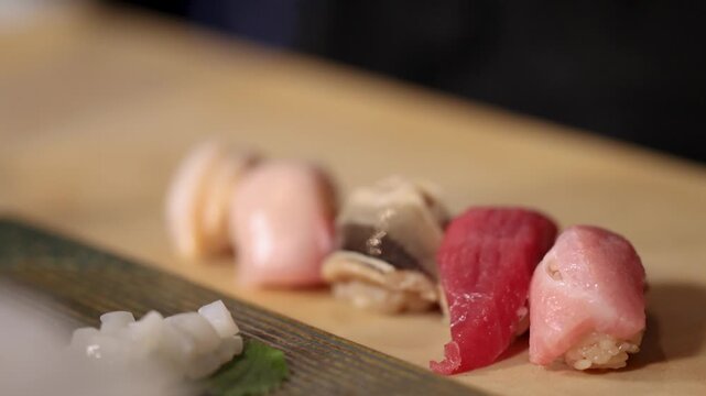 Assorted Nigiri Sushi with Tuna and Shellfish on Wooden Counter