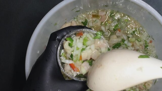 Hands Serving Fresh Ceviche into Plastic Cup with Dome Lid, Street Food Concept, Costa Rica