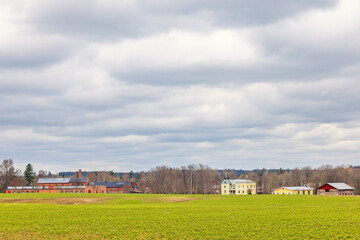 Obraz premium Old Industry in the countryside by a green field