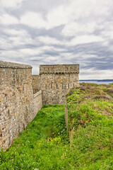 Fort du toulinguet with a moat and a fortified tower on the french coast