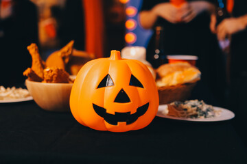 Friends enjoying a Halloween party at a bar making a toast