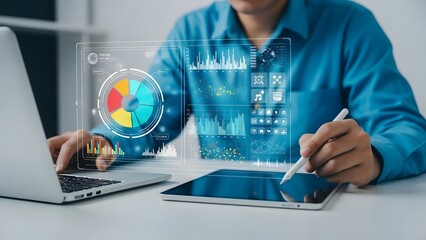 Financial analyst using a digital tablet and laptop to analyze colorful data charts and business metrics