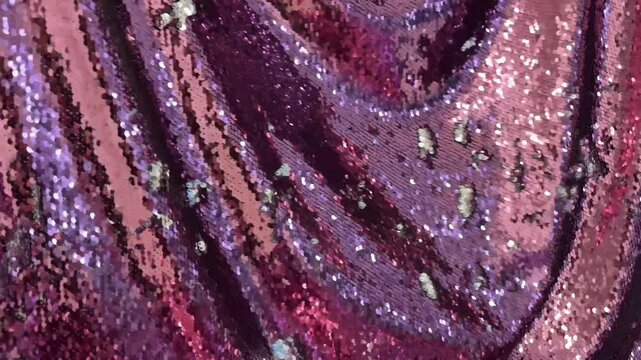 Bright pink sequins texture fabric, holiday background. 