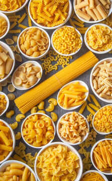 Composition with different tasty uncooked pasta - Italian pasta wallpaper, different types and shapes of pasta layout