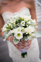 Bride Holding Elegant White Floral Wedding Bouquet