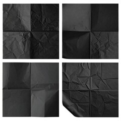 Four black paper sheets folded and arranged, some crumpled