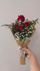 A vibrant bouquet of roses, showcasing a beautiful blend of red. Each flower tells a story of affection and beauty