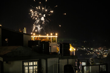 People of Northeast India celebrate new year on the rooftops and balconies at home watching fireworks at midnight