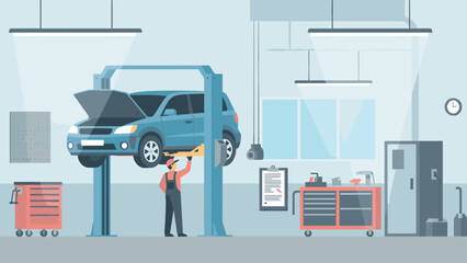 Mechanic working on elevated car in modern auto repair garage