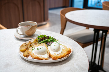 Eggs Benedict breakfast in a restaurant.