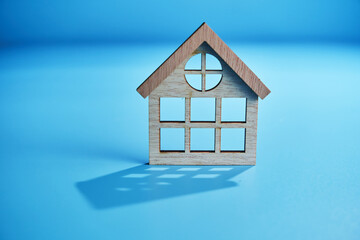 small house model against blue background