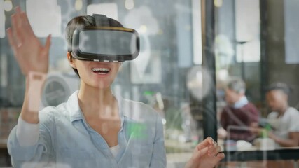 Multiple digital icons floating against caucasian senior man wearing vr headset at office - Powered by Adobe