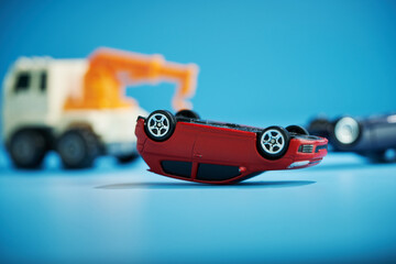 toy car accident, car accident overturn with tow truck.