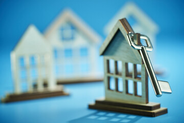 model house  with silver house key.