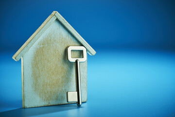 model house  with silver house key.