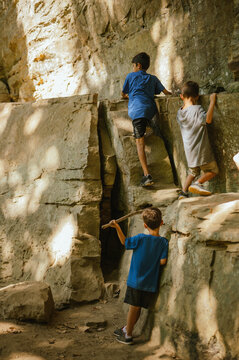 Kids climbing large rocks at Turkey Run State Park, Indiana