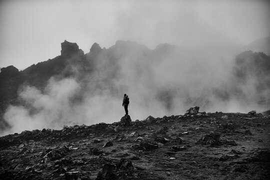 Hiker in front of fumarole in Kerlingerfjoll