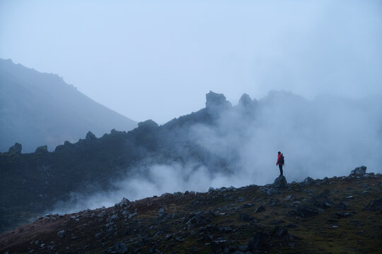 Hiker in front of fumarole in Kerlingerfjoll