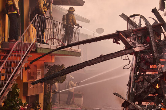 Firefighters Battle Blaze in Wildfire Raging Through Alta Dena