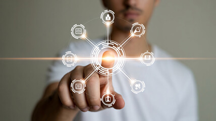 A man in a white shirt interacting with a futuristic digital interface