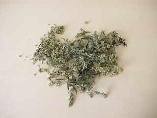 Dried Mugwort on a wooden background