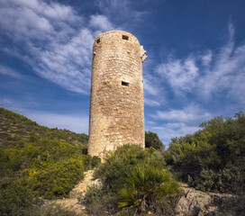 Exploring Badum Tower in scenic Peniscola, Spain under blue skies
