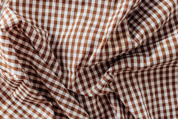 Brown and White Checkered Fabric with Soft Textures and Creases